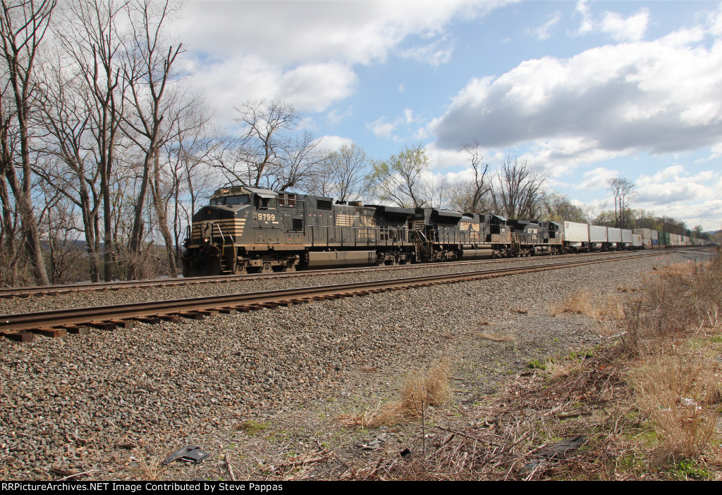 NS 9779 takes train 25G west through Cove, PA